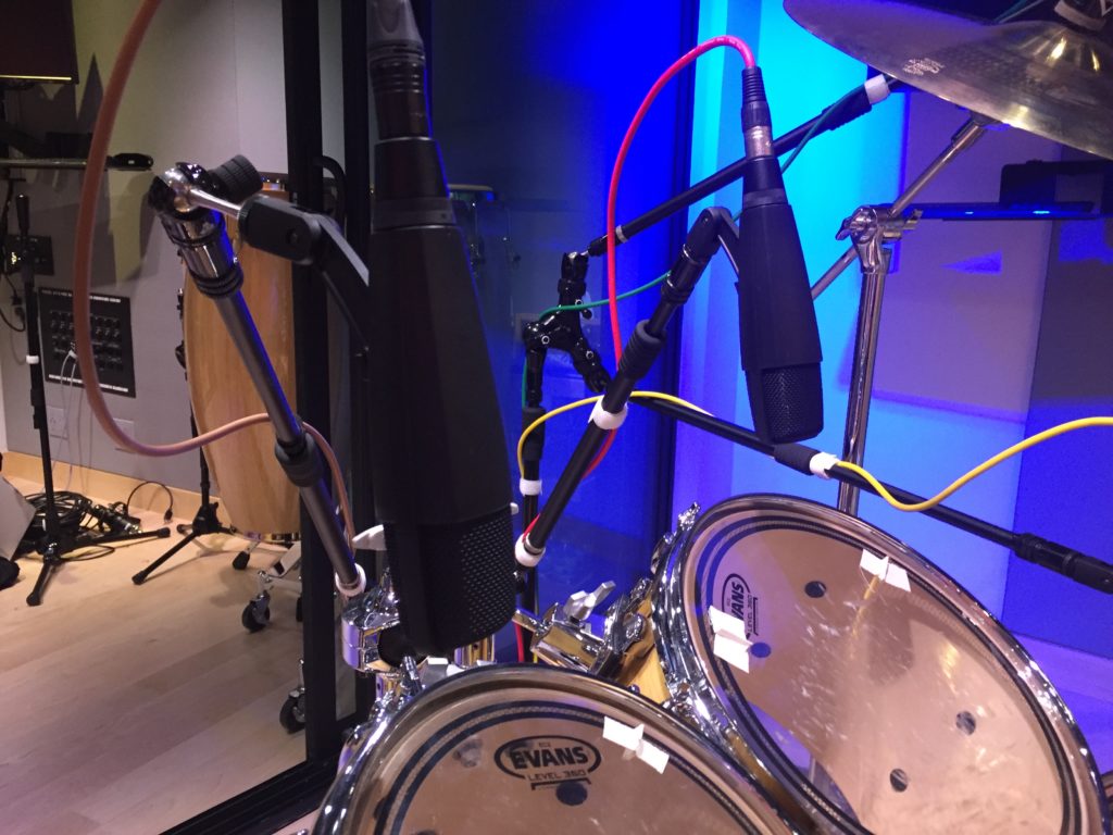 Sennheiser MD421 microphones mounted over tom drums