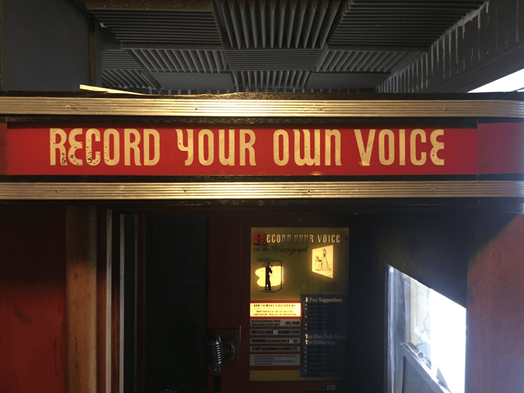 The RECORD YOUR OWN VOICE sign at SongByrd Cafe