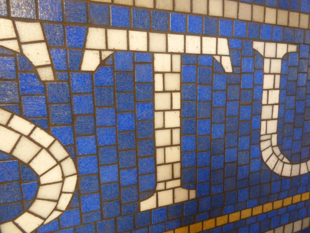 detail view of the mosaic tile STUDIO sign in the ULS lobby
